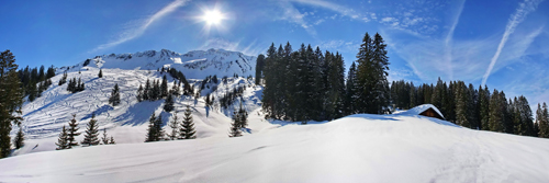kerstdorp achtergrond winterlandschap met zon